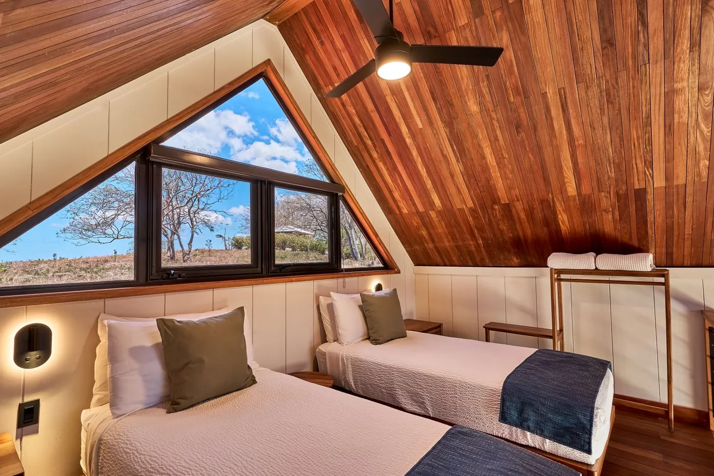 TreeCasa cabin — warm wood interior with natural light and forest views