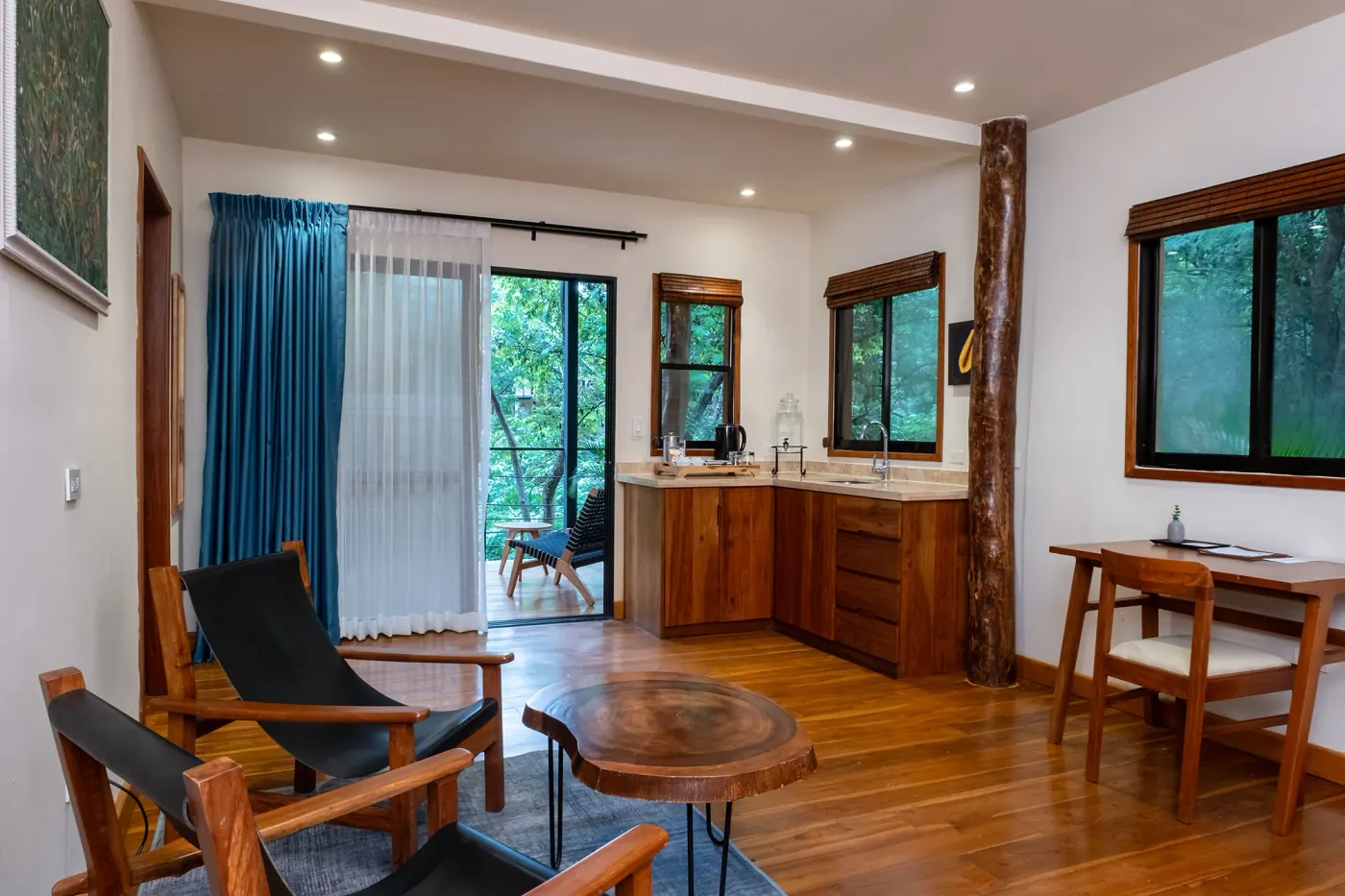 Canopy suite at TreeCasa — private balcony and hammocks overlooking the forest