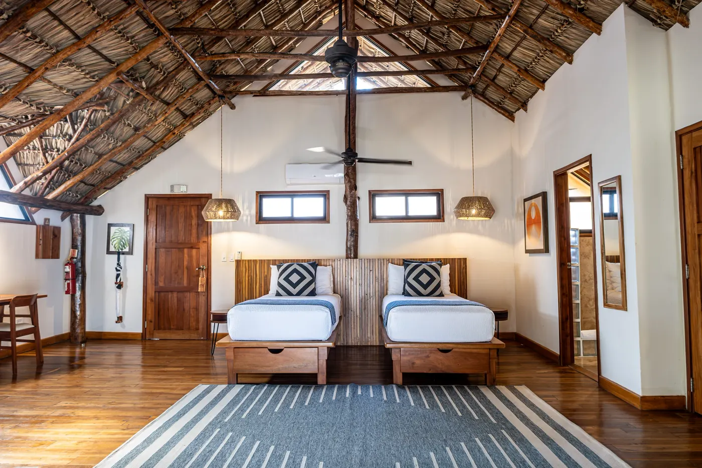 Canopy suite at TreeCasa — private balcony and hammocks overlooking the forest