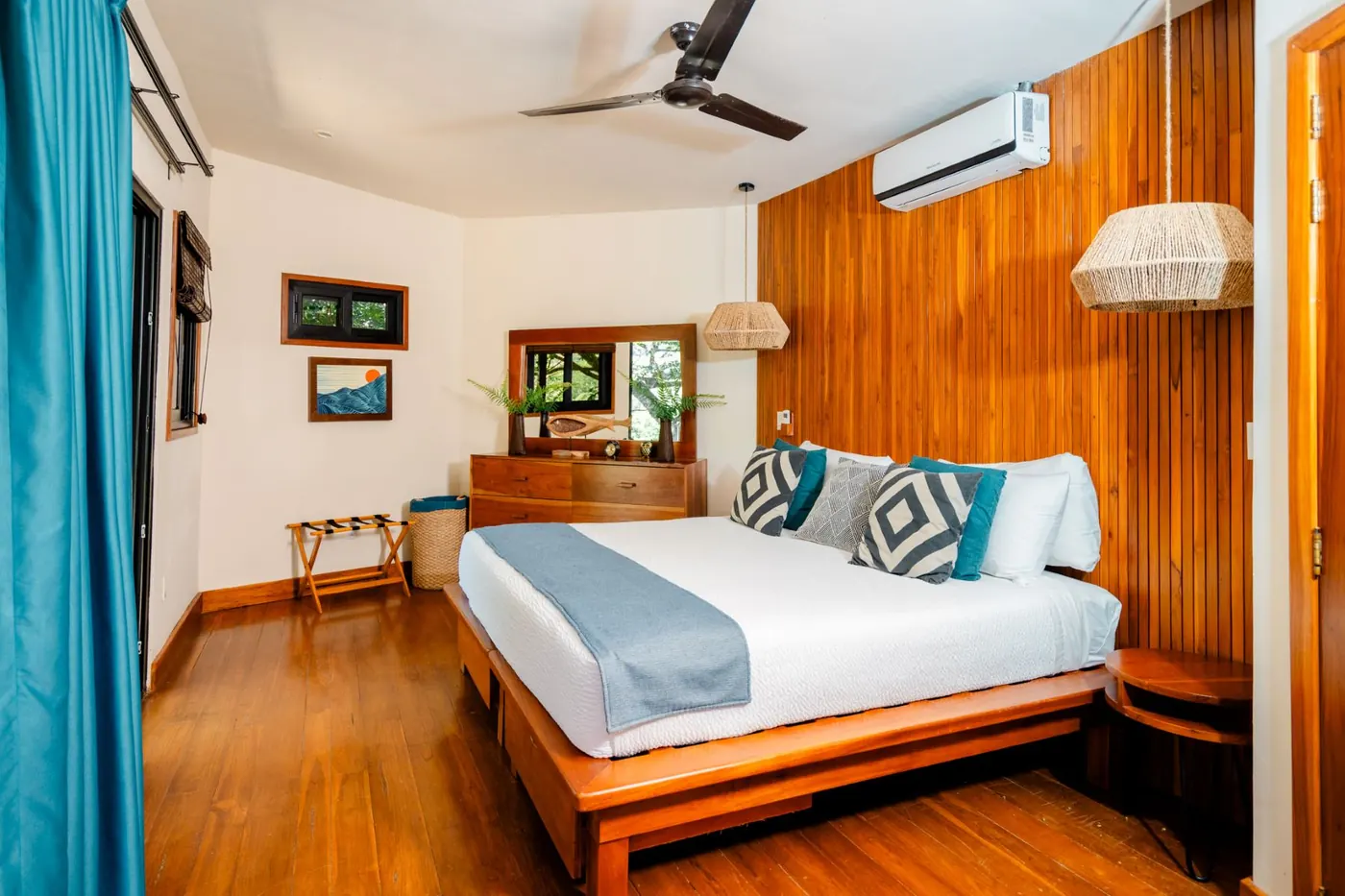 Casa Árbol at TreeCasa — two-story treehouse with thatched ceiling and ceiba views